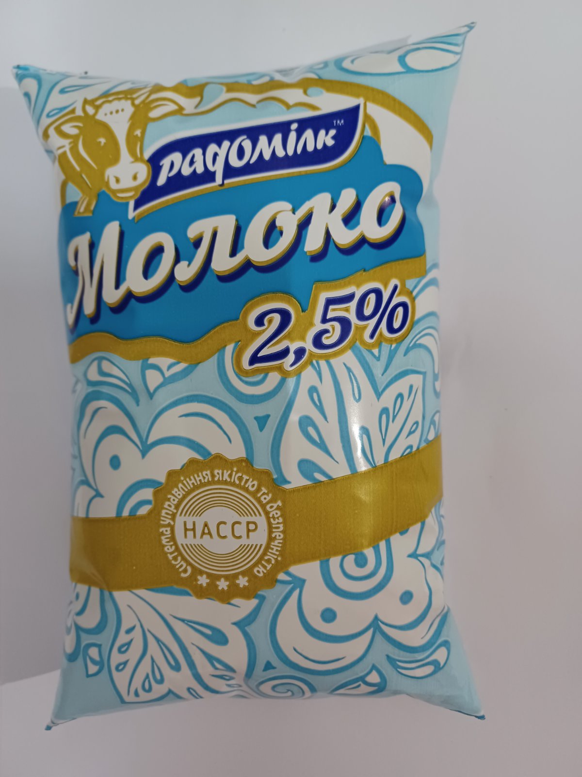 Молоко РАДОМІЛК 2,5 % 870 г., плівка поліетиленова
